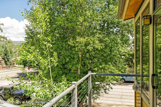 front view of a house with a tree