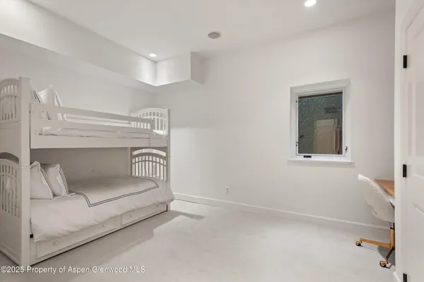 front view of a house with a tree