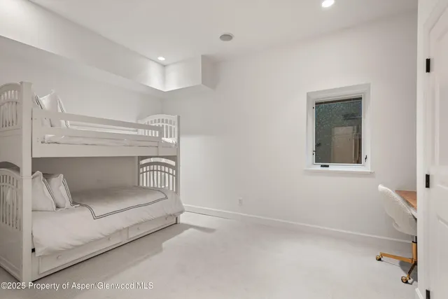 front view of a house with a tree