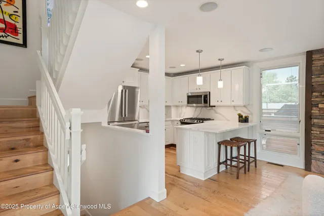 a living room with fireplace furniture and a flat screen tv