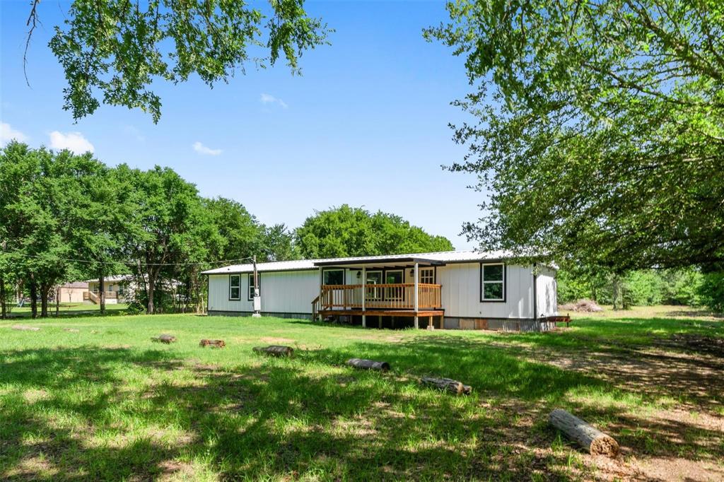 19930 Leisure Land Road Payne Springs, TX 75156 - Photo 3 of 21 a view of a house with backyard
