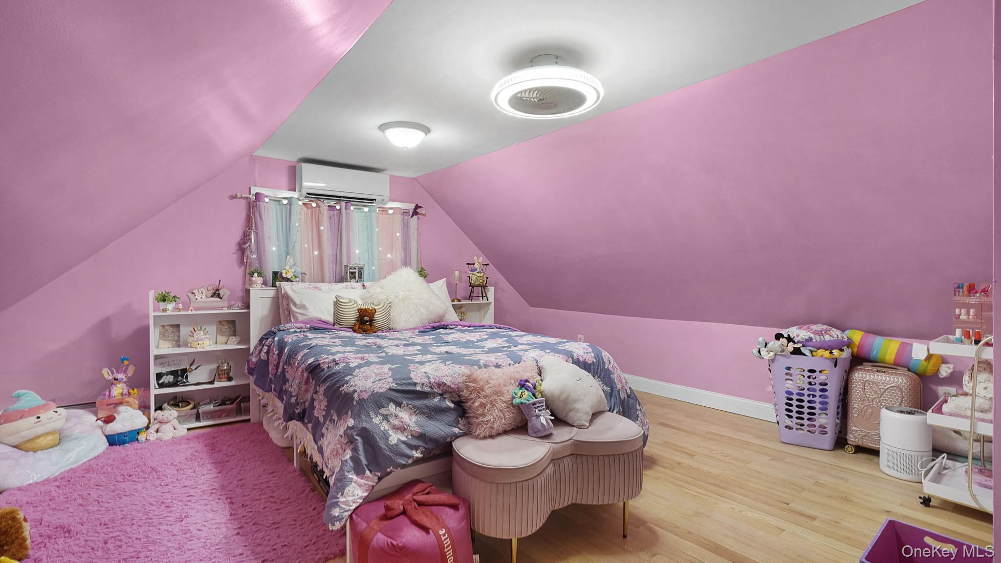 172-17 Amelia Road Queens, NY 11434 - Photo 13 of 18 a bedroom with a bed and a tv