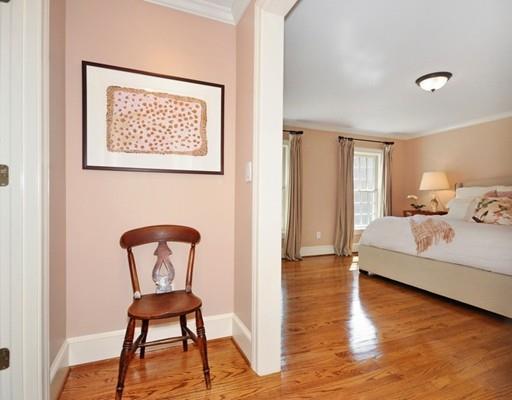 8 Edmonds Road Concord, MA 01742 - Photo 11 of 36 a bedroom with a bed and a chair