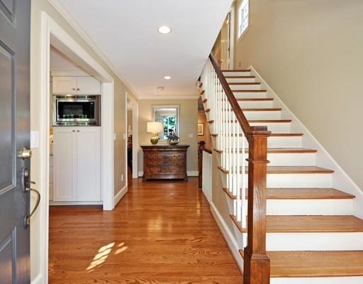 8 Edmonds Road Concord, MA 01742 - Photo 16 of 36 a view of a livingroom with wooden floor and stairs