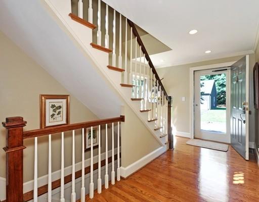8 Edmonds Road Concord, MA 01742 - Photo 23 of 36 a view of staircase with lots of frames on wall and wooden floor
