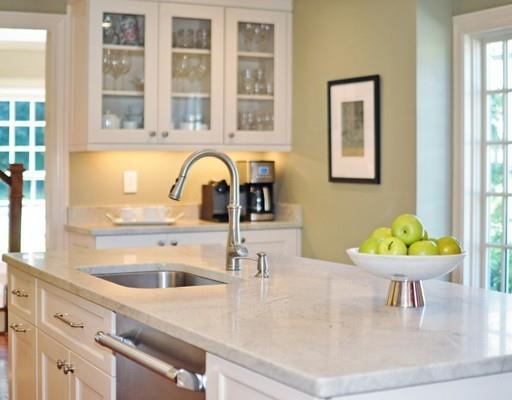 8 Edmonds Road Concord, MA 01742 - Photo 25 of 36 a kitchen with a sink a table and chairs