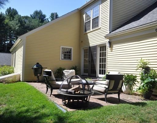 8 Edmonds Road Concord, MA 01742 - Photo 32 of 36 a backyard of a house with table and chairs