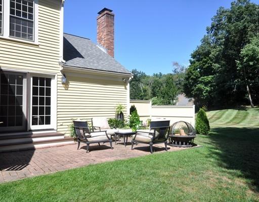 8 Edmonds Road Concord, MA 01742 - Photo 33 of 36 a view of a patio with table and chairs with wooden fence and plants