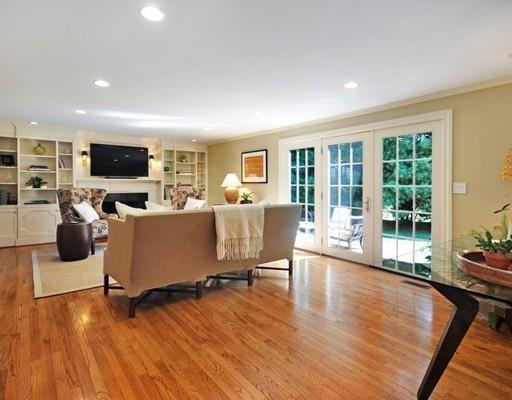 8 Edmonds Road Concord, MA 01742 - Photo 5 of 36 a living room with furniture flat screen tv and wooden floor