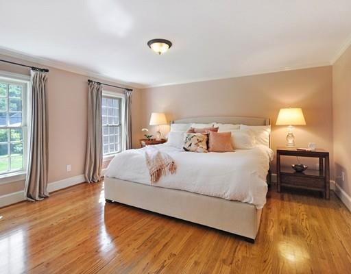 8 Edmonds Road Concord, MA 01742 - Photo 8 of 36 a bedroom with a bed and wooden floor