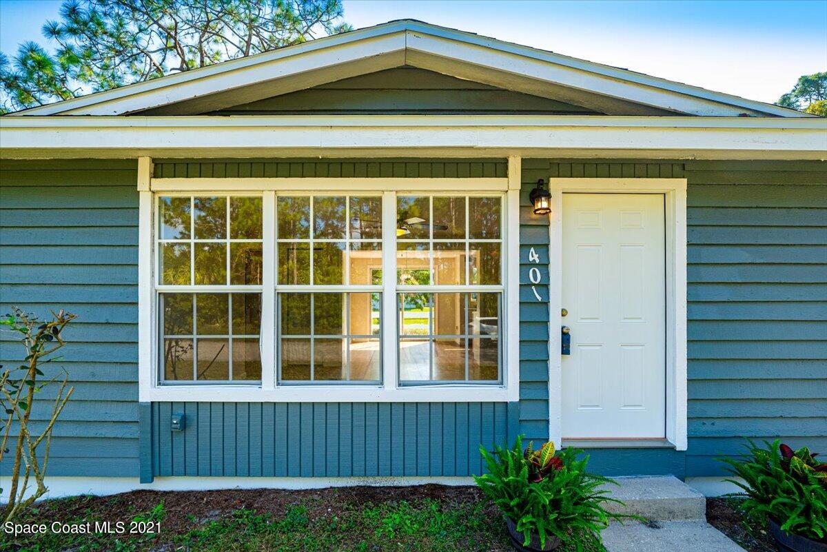 401 Tilhal Road Southwest Palm Bay, FL 32908 - Photo 3 of 26 a view of a house with a yard