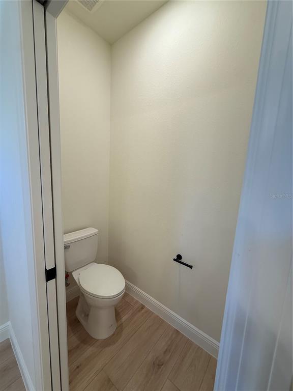 26275 Explorer Road Punta Gorda, FL 33983 - Photo 13 of 22 a white toilet sitting next to a shower