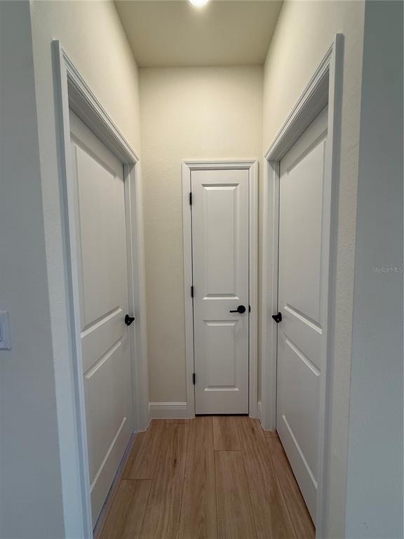 26275 Explorer Road Punta Gorda, FL 33983 - Photo 16 of 22 a view of a hallway with wooden floor