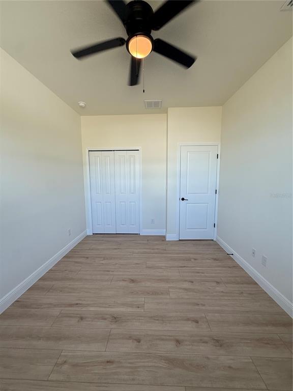 26275 Explorer Road Punta Gorda, FL 33983 - Photo 18 of 22 a view of empty room with wooden floor