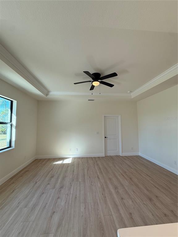 26275 Explorer Road Punta Gorda, FL 33983 - Photo 9 of 22 wooden floor in an empty room with a window