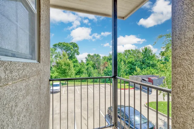 a view of a garden from a balcony