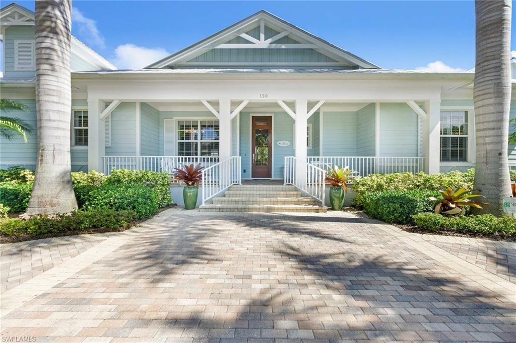 150 Central Avenue Naples, FL 34102 - Photo 2 of 34 a front view of a house with garden