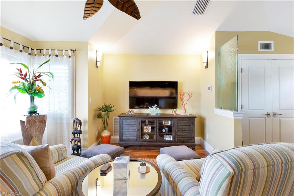 150 Central Avenue Naples, FL 34102 - Photo 23 of 34 a living room with furniture and a flat screen tv