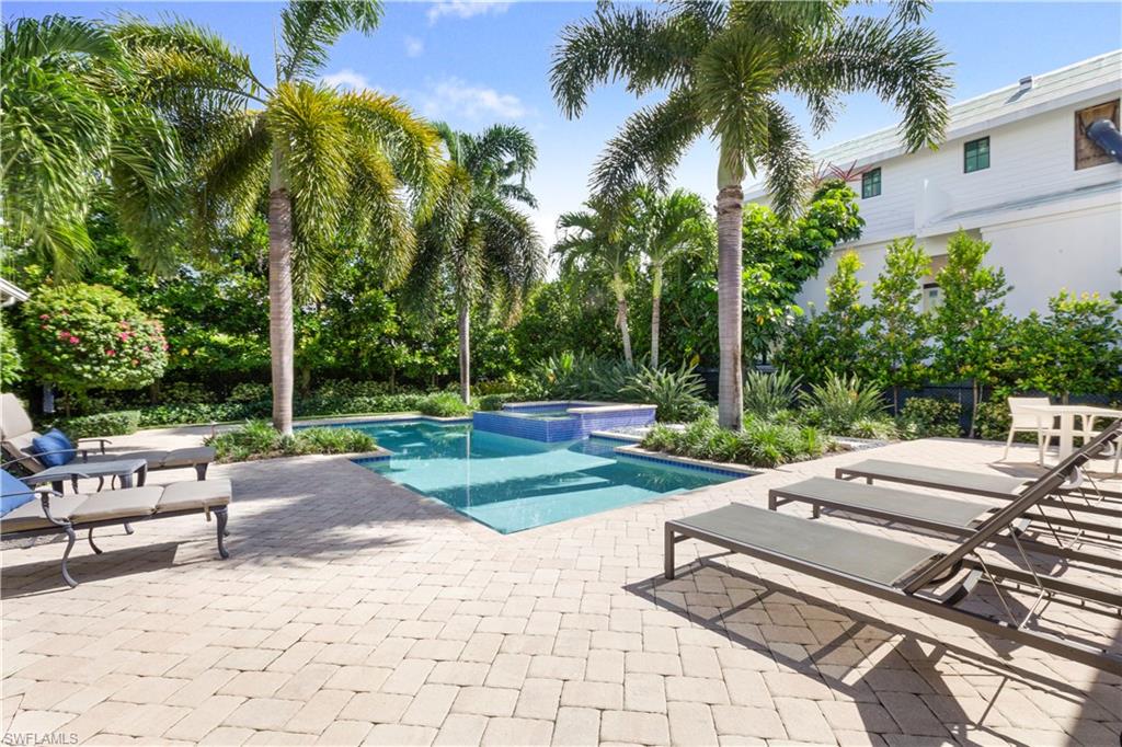 150 Central Avenue Naples, FL 34102 - Photo 27 of 34 a view of a backyard with sitting area