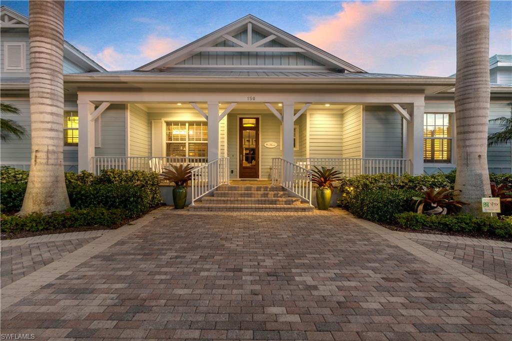 150 Central Avenue Naples, FL 34102 - Photo 31 of 34 a front view of a house with garden