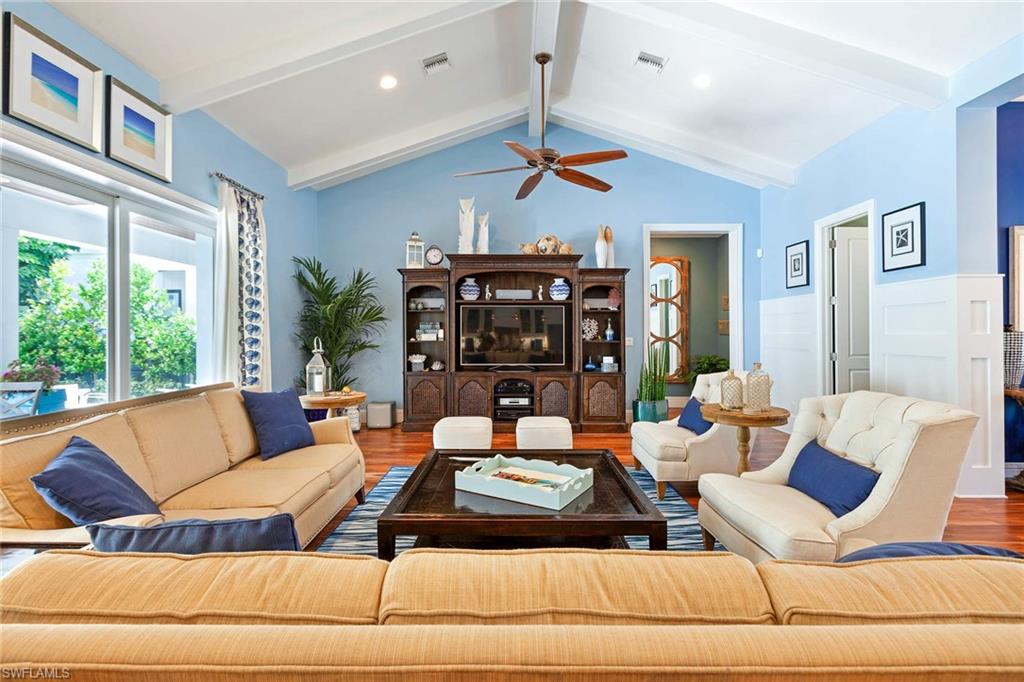 150 Central Avenue Naples, FL 34102 - Photo 6 of 34 a living room with furniture and a large window