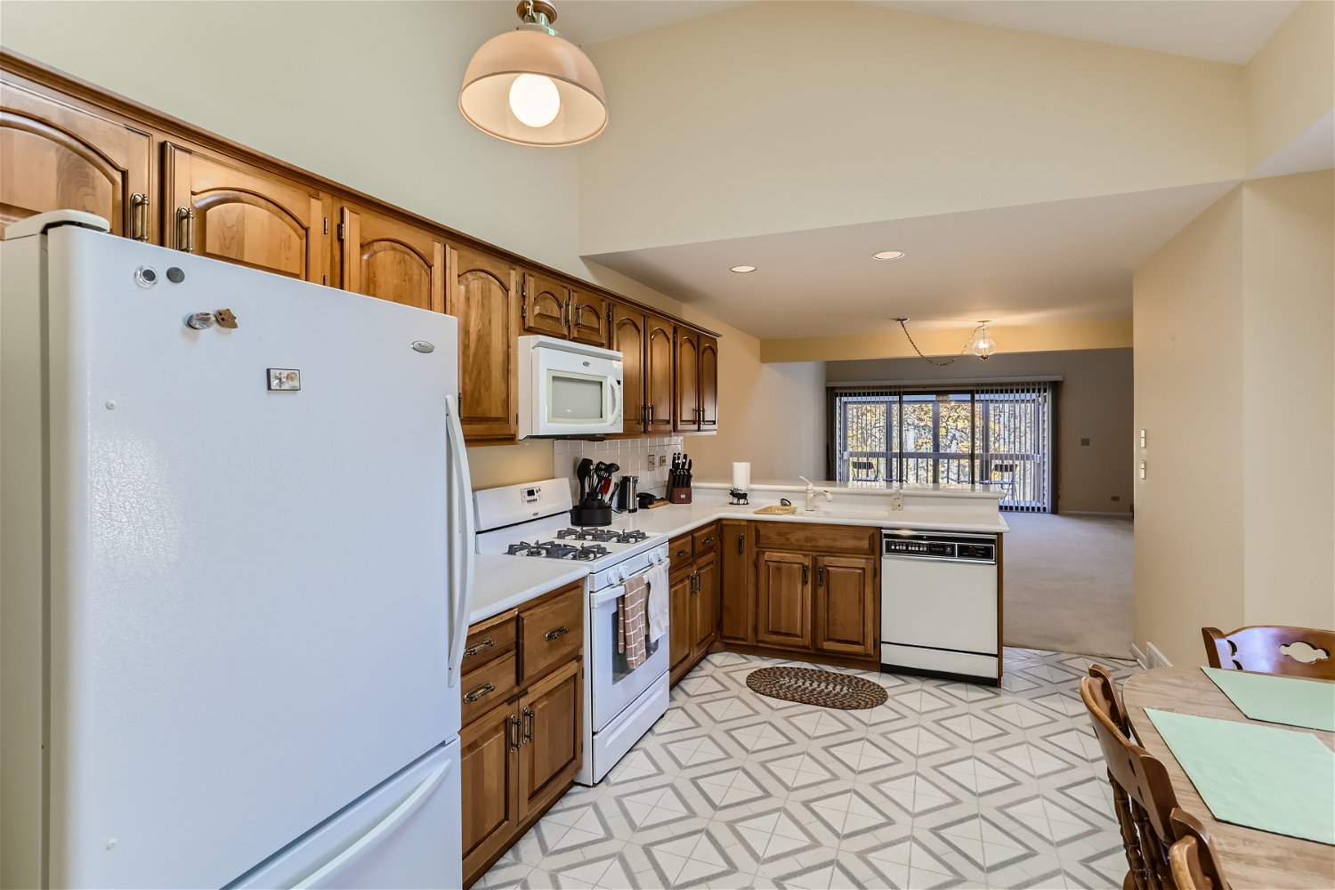 254 Spring Cove Drive Elgin, IL 60123 - Photo 11 of 37 a kitchen with sink cabinets and window