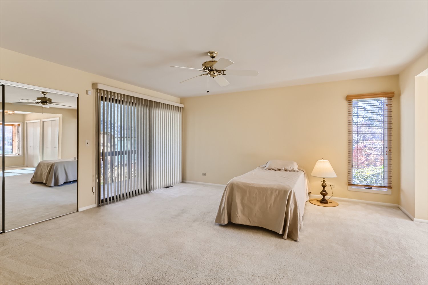 254 Spring Cove Drive Elgin, IL 60123 - Photo 15 of 37 a spacious bedroom with a bed and ceiling fan
