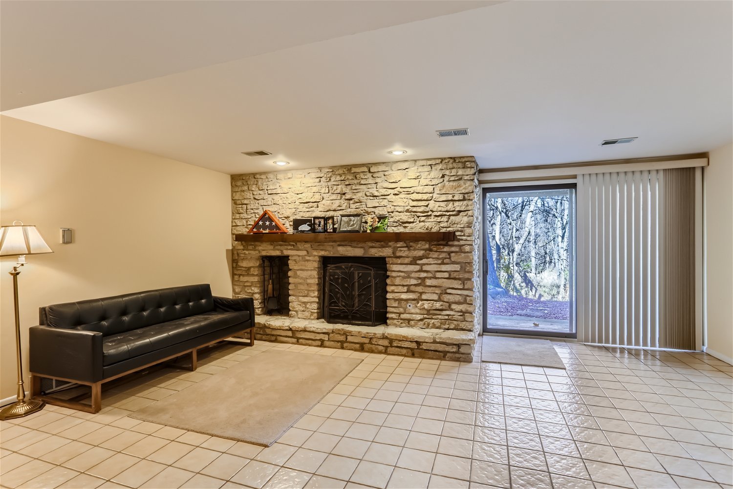 254 Spring Cove Drive Elgin, IL 60123 - Photo 23 of 37 a view of an empty room with a fireplace and a window