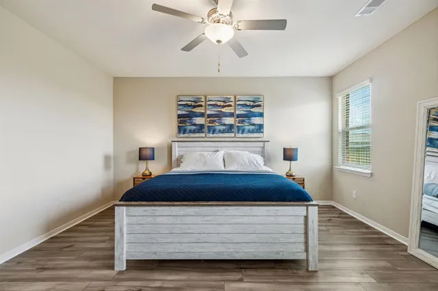 a room with a bed and a chandelier