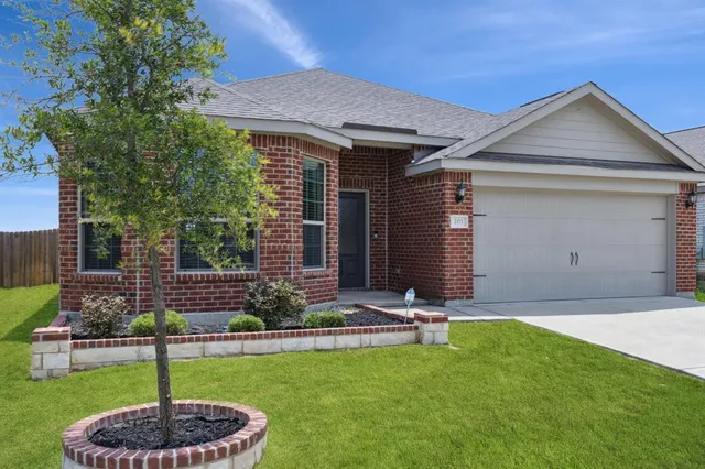 a backyard of a house with yard and outdoor seating