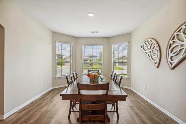 a view of a room with furniture window and wooden floor