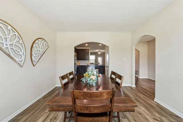 a view of a room with furniture and wooden floor