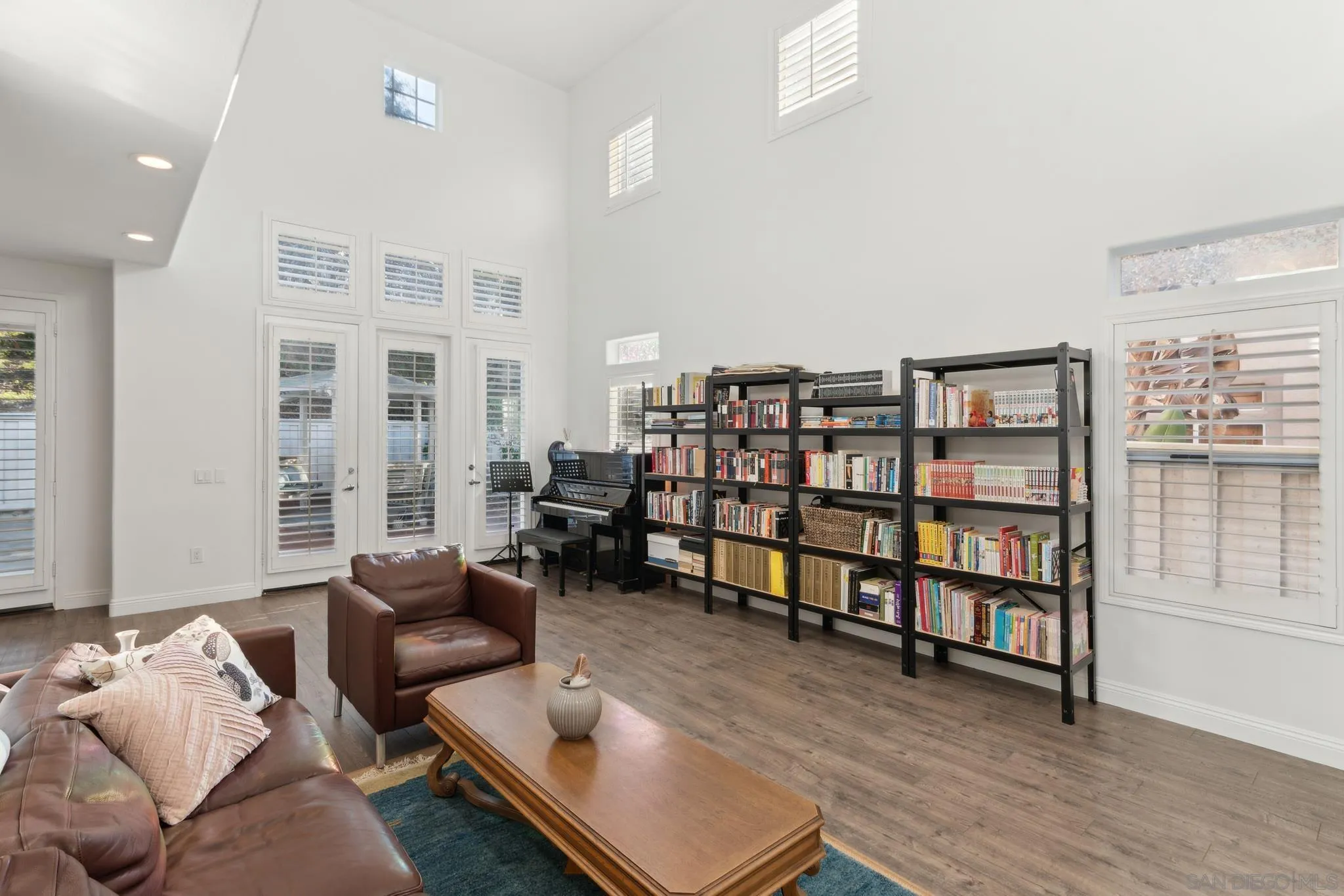 3682 Via Bernardo Oceanside, CA 92056 - Photo 2 of 30 a living room with furniture and a book shelf