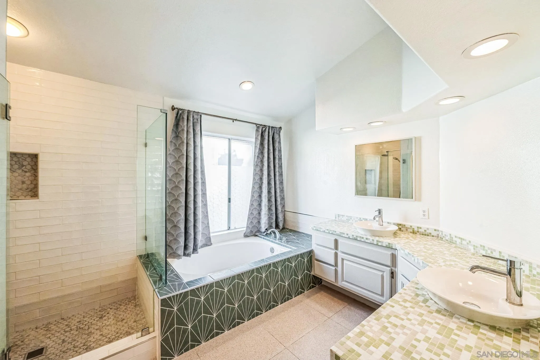 3682 Via Bernardo Oceanside, CA 92056 - Photo 22 of 30 a spacious bathroom with a tub sink and mirror