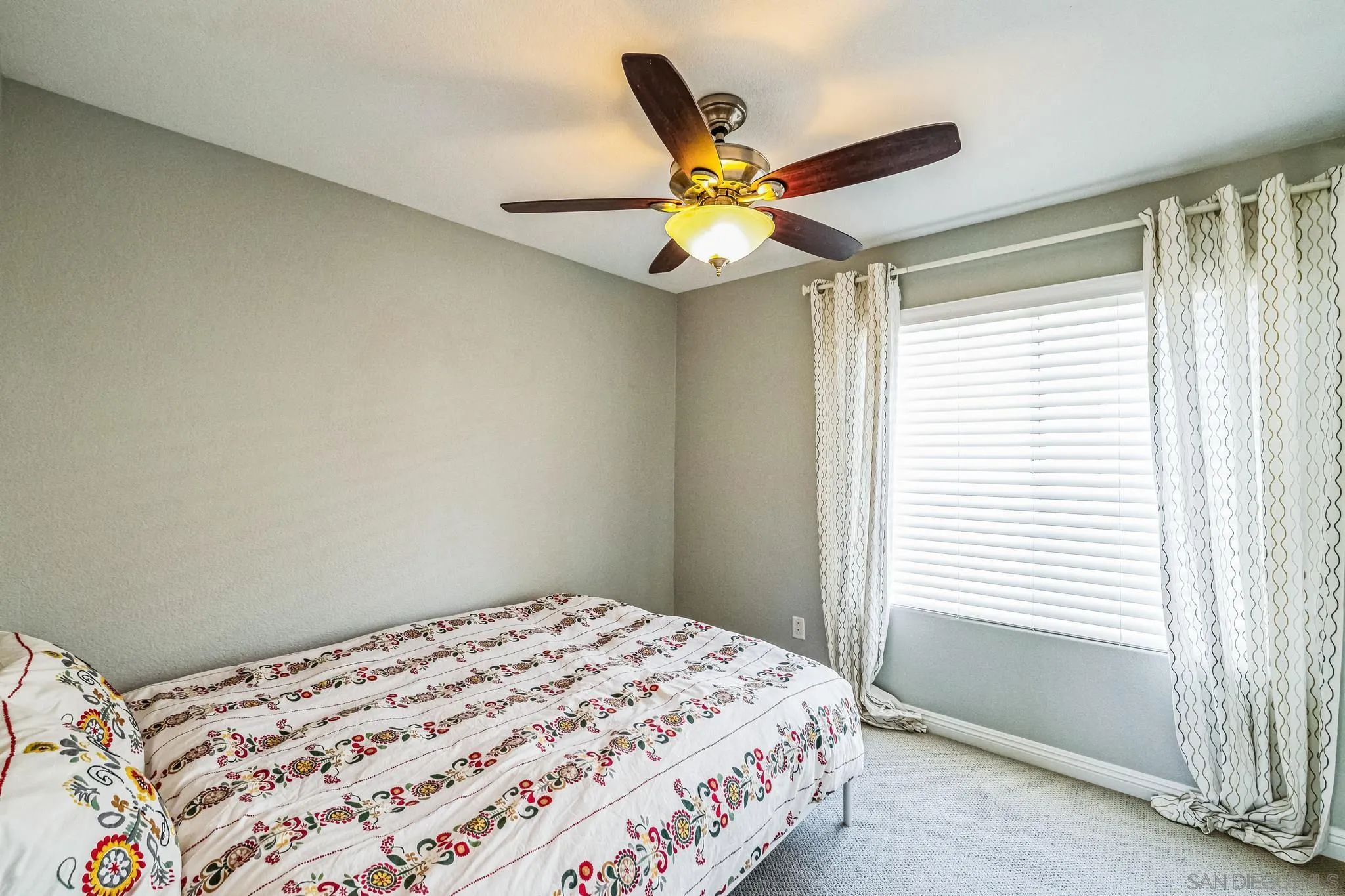 3682 Via Bernardo Oceanside, CA 92056 - Photo 26 of 30 a bedroom with a bed and a window