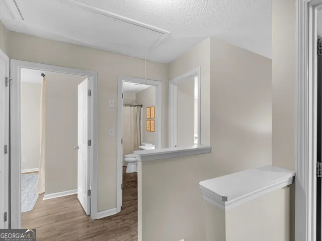 a living room with furniture a lamp and a ceiling fan