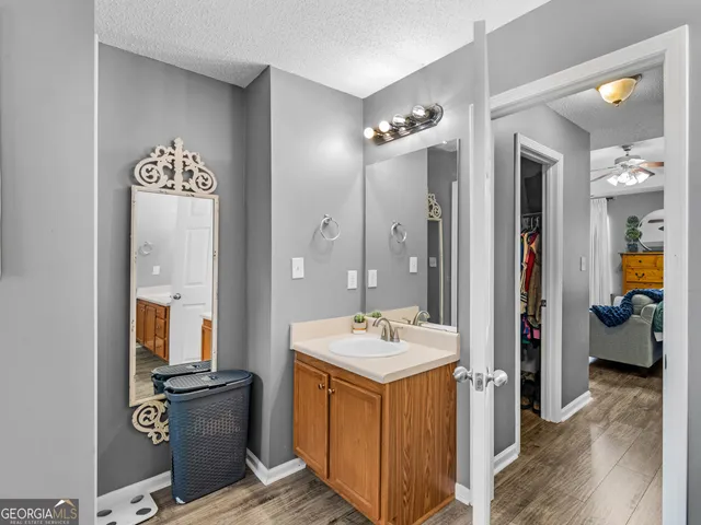 a view of an empty room and wooden floor