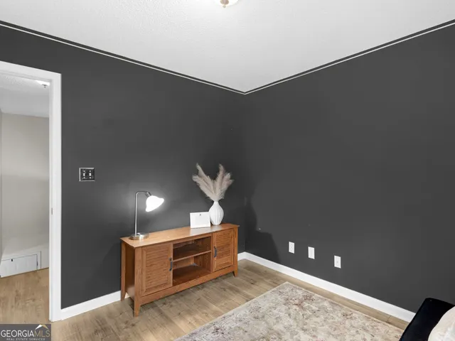 a bedroom with bed and a chandelier