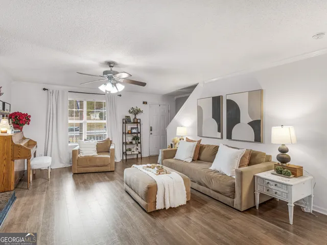 a bedroom with bed and wooden floor