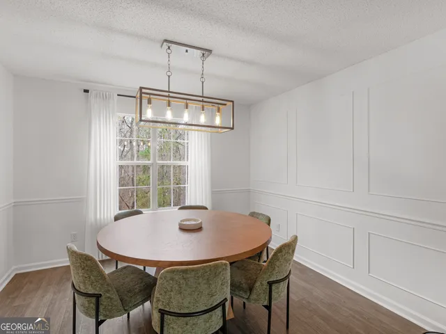 a kitchen with a sink stove and microwave