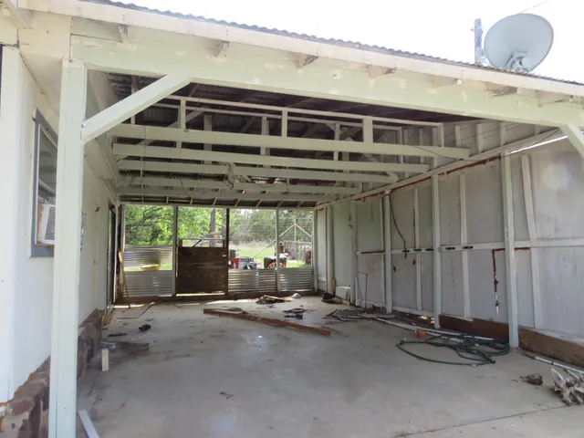 a room with gym equipment and a large window