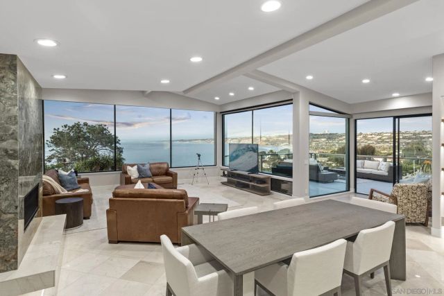 a large kitchen with a table and chairs