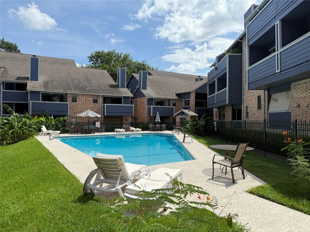 2500 Burleson Road, Unit 317 Austin, TX 78741 - Photo 11 of 12 a view of a house with pool porch and chairs