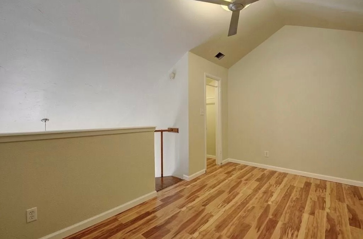 2500 Burleson Road, Unit 317 Austin, TX 78741 - Photo 7 of 12 a view of a room with wooden floor
