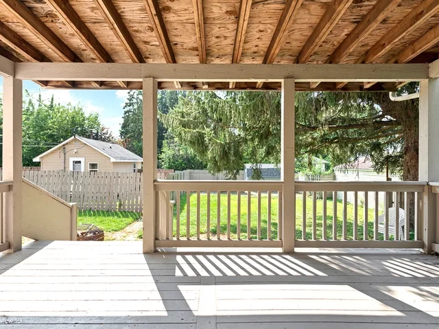 a view of a house with swimming pool and a yard