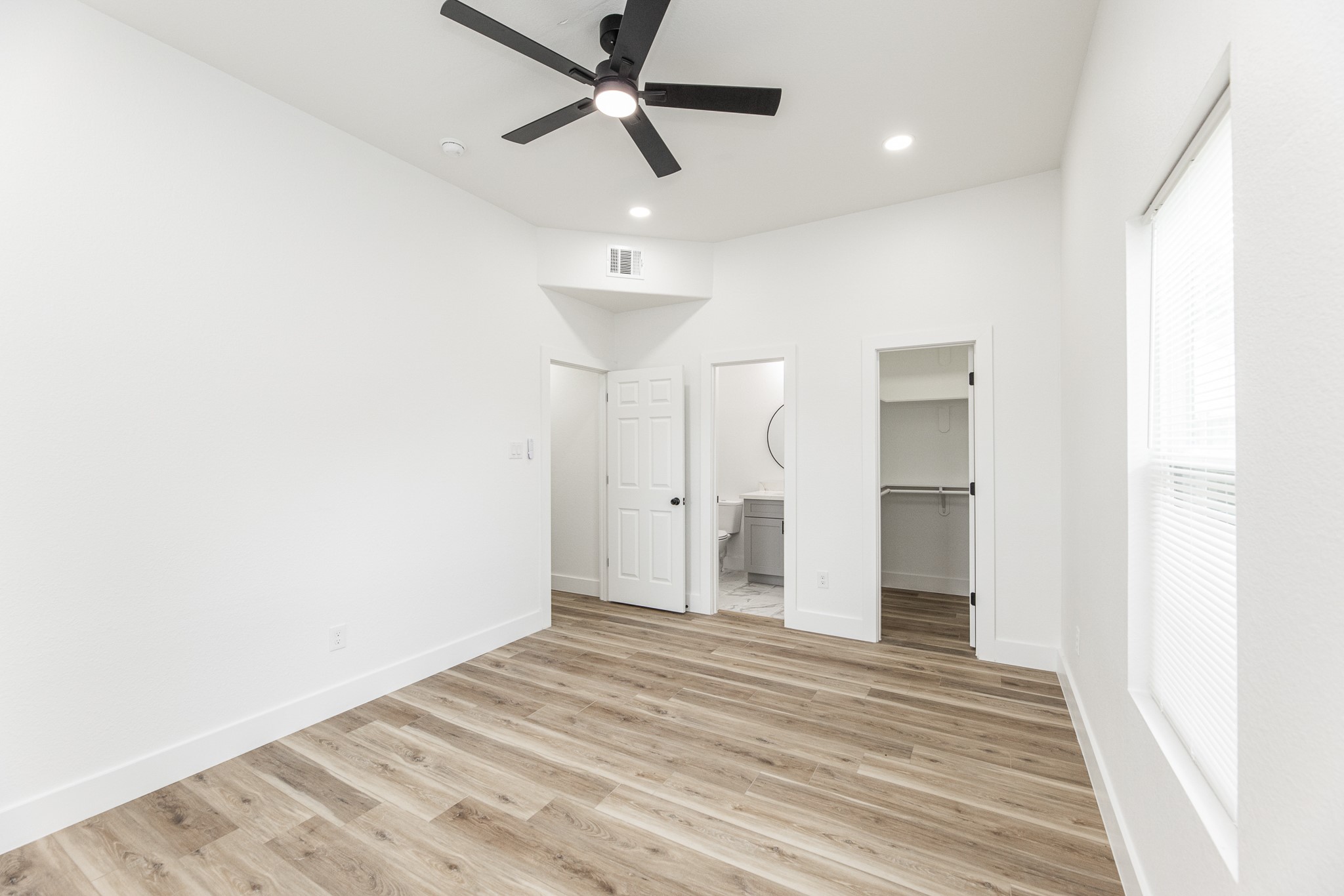 9727 Stedman Street Houston, TX 77029 - Photo 17 of 23 Primary bedroom with a walk in closet