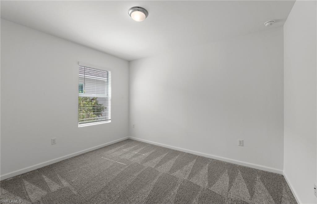 15893 Northridge Road Punta Gorda, FL 33982 - Photo 29 of 50 an empty room with a window