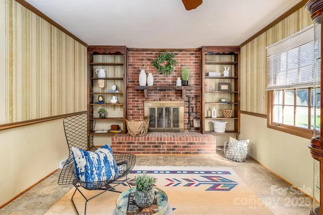 a bedroom with furniture and a book shelf