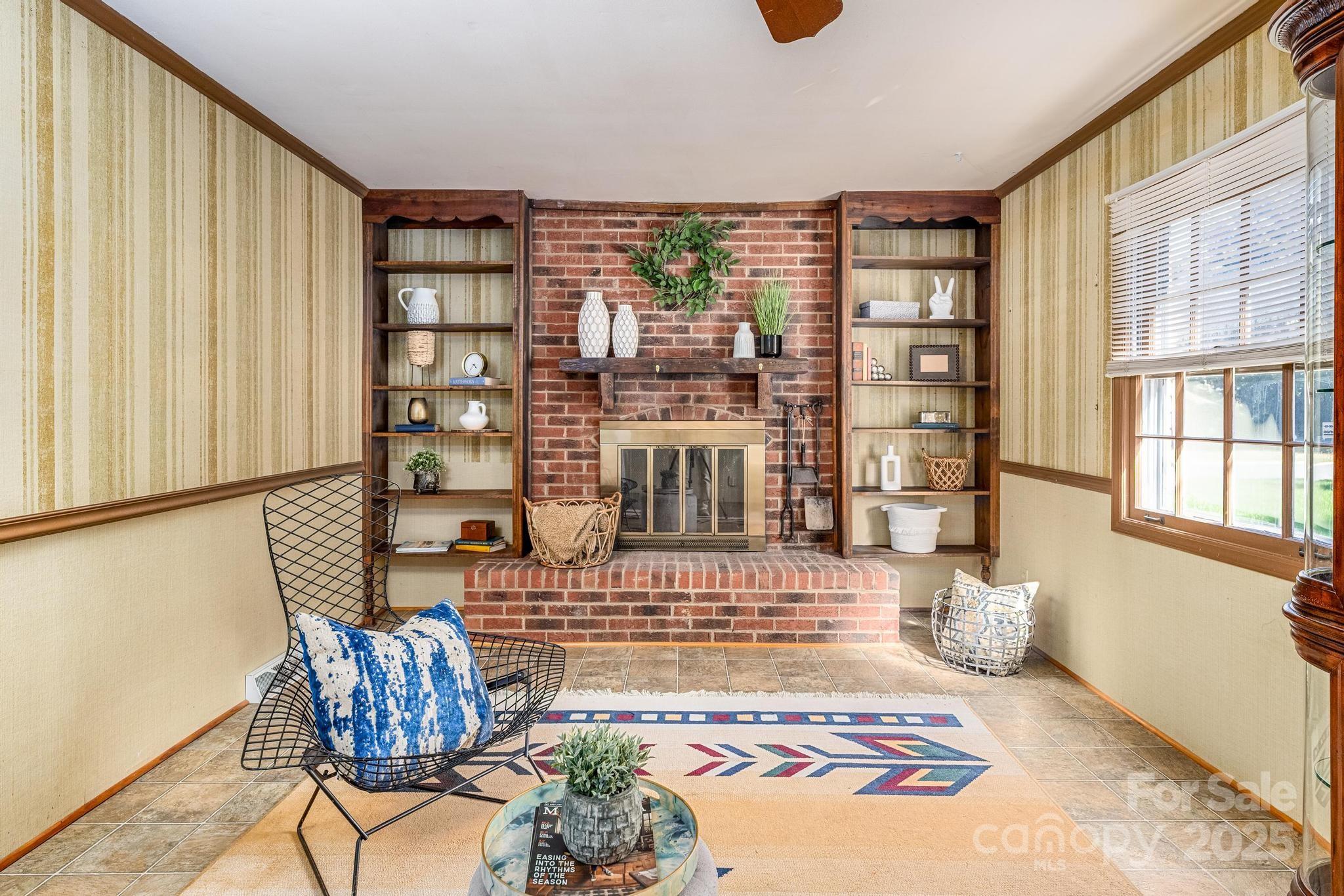 4314 Ivanhoe Place, Unit 26 Charlotte, NC 28205 - Photo 11 of 25 a bedroom with furniture and a book shelf