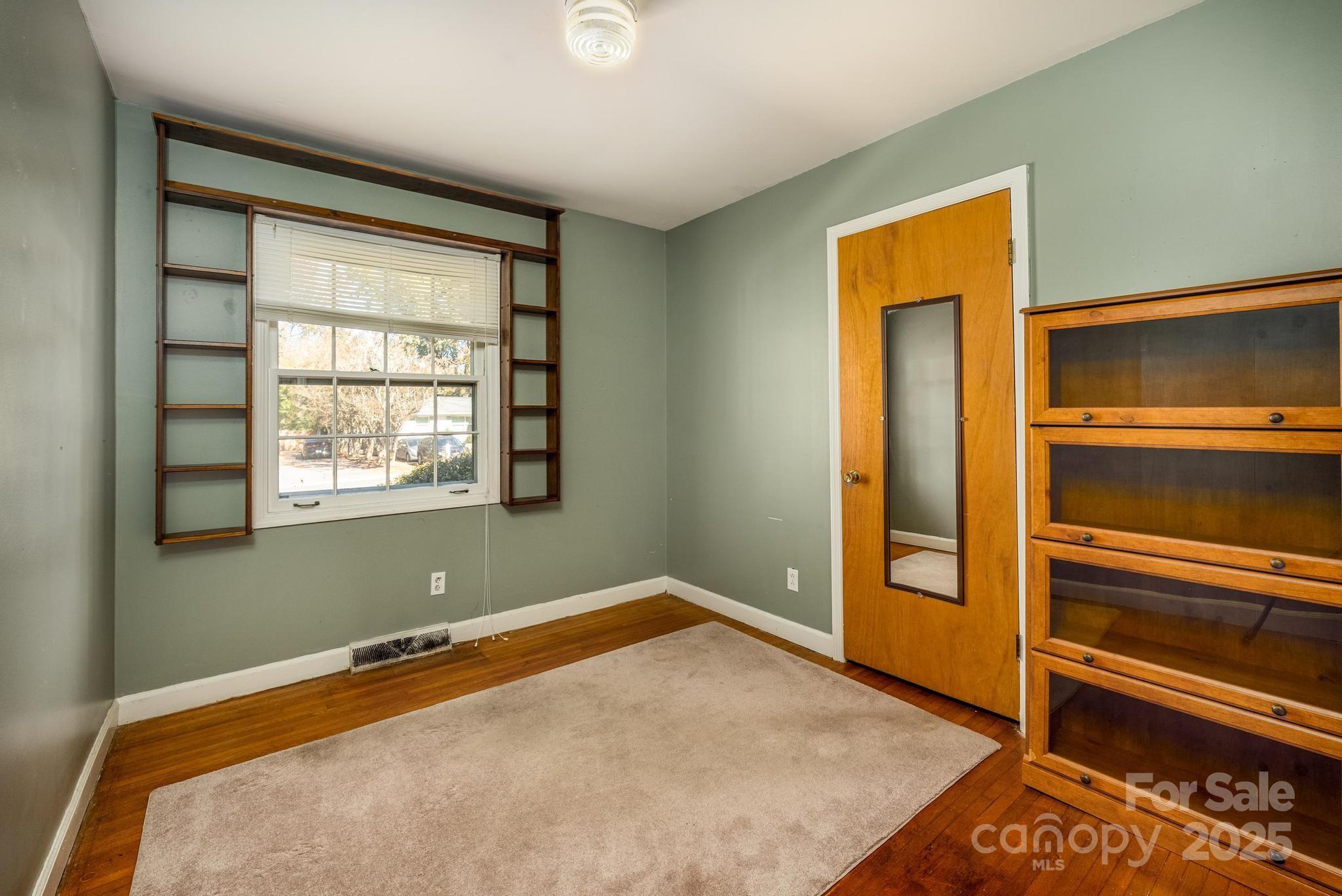 4314 Ivanhoe Place, Unit 26 Charlotte, NC 28205 - Photo 17 of 25 an empty room with a window
